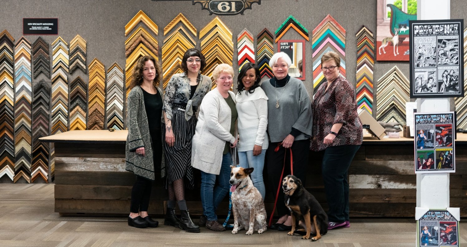 The Leading Ladies at Providence Picture Frame, left to right: Miranda Harreys, Mary Lindberg, Lisa Bushee, Diolinda Pereira, and Lisa Lagory, and PPF mascots Edie and Emma